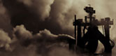 Image:  Chimneys emitting clouds of polution into the atmosphere